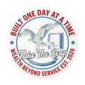 Sticker — "Take The Leap" Round Vinyl Sticker (Built One Day at a Time, Wealth Beyond Service Est. 2026)